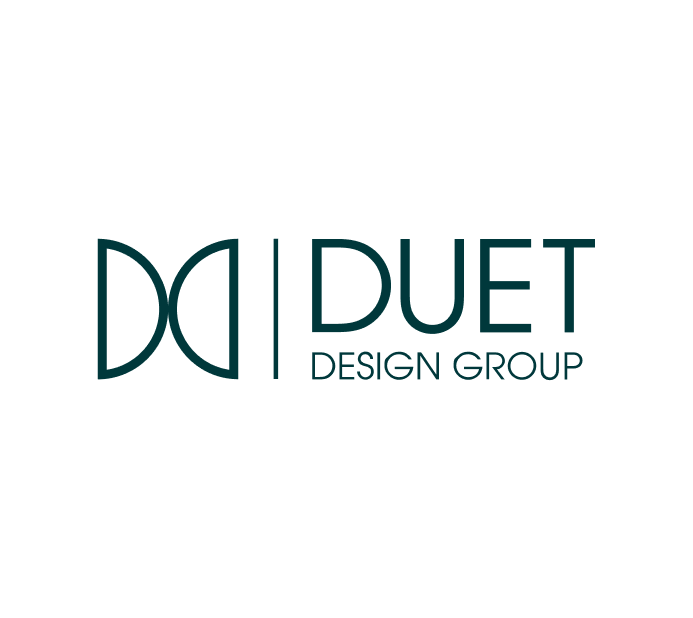 The image features the logo for Duet Design Group, showcasing a stylized, modern design. The logo consists of two interconnected "D"s, which represent the concept of harmony and collaboration, aligning with the company's name "Duet." The logo design emphasizes a clean, professional look with an elegant typeface, conveying sophistication and design expertise. The overall color scheme reflects a refined and contemporary aesthetic suitable for a design-oriented business.