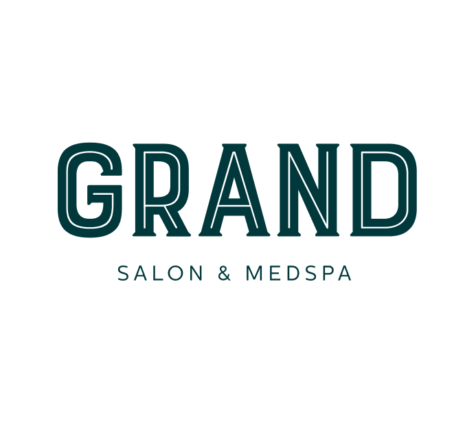 The image features the logo for Grand Salon & MedSpa. The logo has bold, capitalized lettering for "GRAND" in a modern, clean typeface, with the words "SALON & MEDSPA" in a smaller, more delicate font beneath. The design conveys a sense of elegance and sophistication, suitable for a high-end salon and medspa.