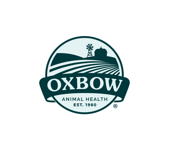 The image features the logo of Oxbow Animal Health. It depicts a circular design with a windmill, barn, and fields, representing the agricultural aspect of the company. The logo includes the words "Oxbow" in large, bold lettering, with "Animal Health" and "EST. 1980" beneath, highlighting the brand's long-standing commitment to animal health since its establishment. The color palette is earthy and natural, evoking a rural, farm-oriented feel.