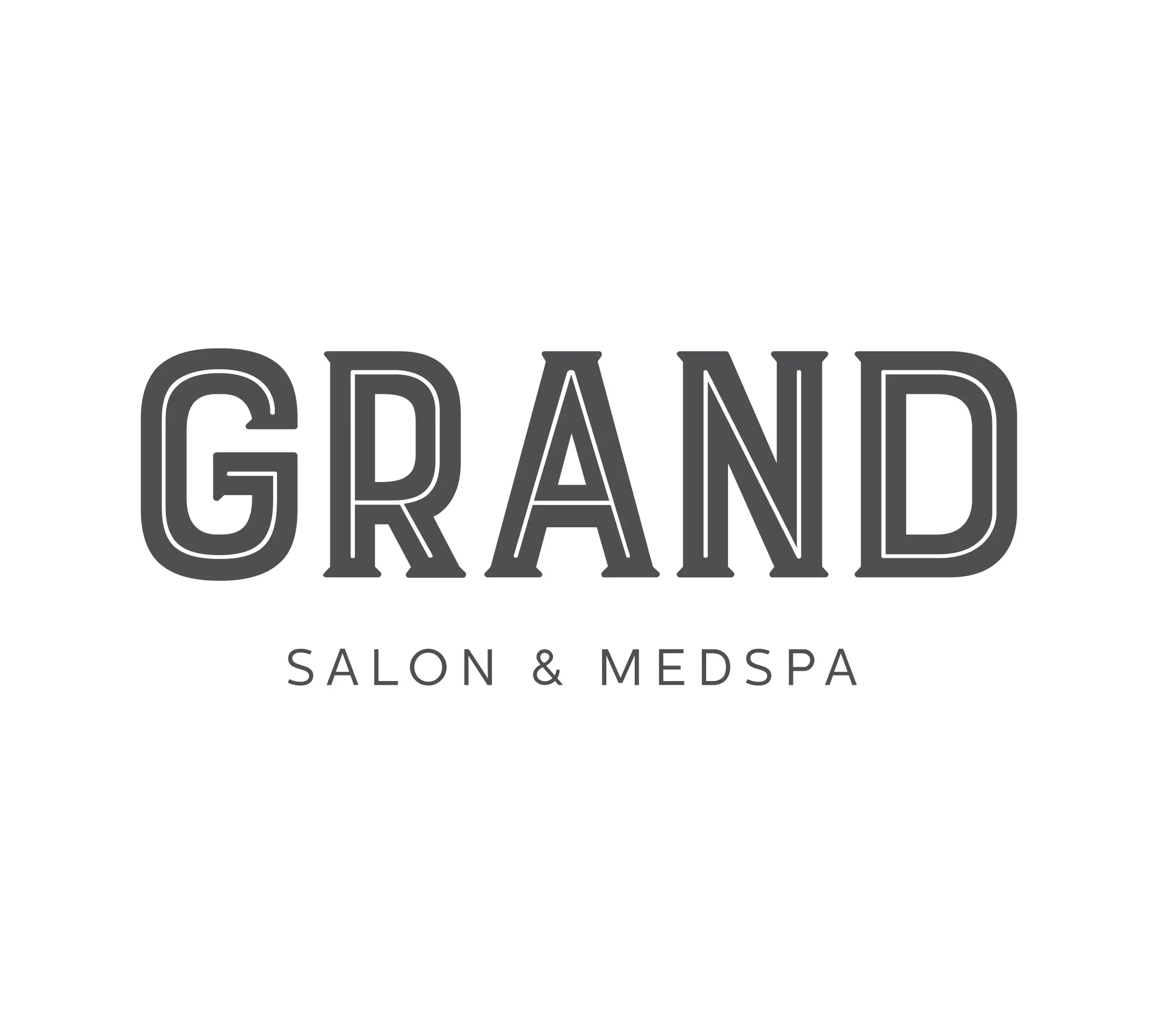 The image shows the logo for "Grand Salon & Medspa." The word "GRAND" is written in bold, stylized uppercase letters, with a vintage-inspired font. Below it, the words "SALON & MEDSPA" appear in a clean, modern sans-serif font, providing a contrast to the more ornate styling of "GRAND." The design conveys a blend of elegance and professionalism, suitable for a high-end beauty and wellness business.