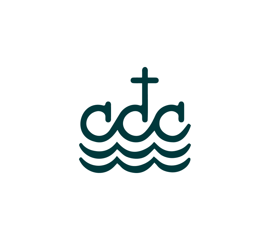 The image features a simple logo consisting of three waves beneath a cross. The waves are stylized and represent water, while the cross sits above the waves in the center. The design uses clean lines and is minimalist, creating a serene and symbolic image. The logo is likely related to a Christian organization or ministry, given the cross and water symbolism. The color is a deep teal.