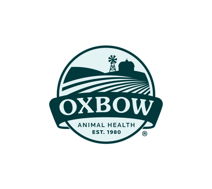 The image features the logo of Oxbow Animal Health. It depicts a circular design with a windmill, barn, and fields, representing the agricultural aspect of the company. The logo includes the words "Oxbow" in large, bold lettering, with "Animal Health" and "EST. 1980" beneath, highlighting the brand's long-standing commitment to animal health since its establishment. The color palette is earthy and natural, evoking a rural, farm-oriented feel.