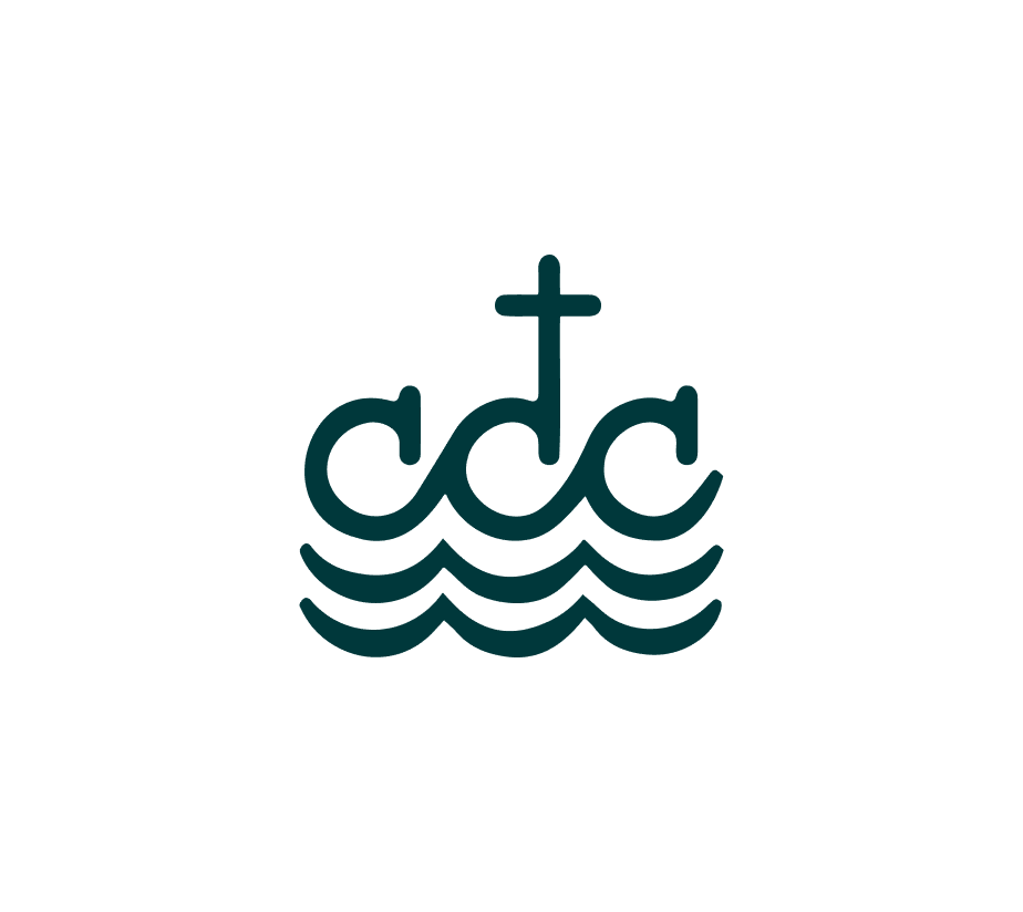 The image features a simple logo consisting of three waves beneath a cross. The waves are stylized and represent water, while the cross sits above the waves in the center. The design uses clean lines and is minimalist, creating a serene and symbolic image. The logo is likely related to a Christian organization or ministry, given the cross and water symbolism. The color is a deep teal.